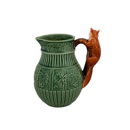 Stylish green pitcher with a ceramic fox